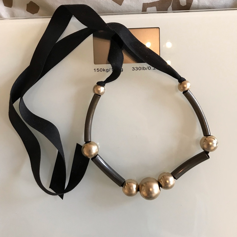 Tiè on necklace